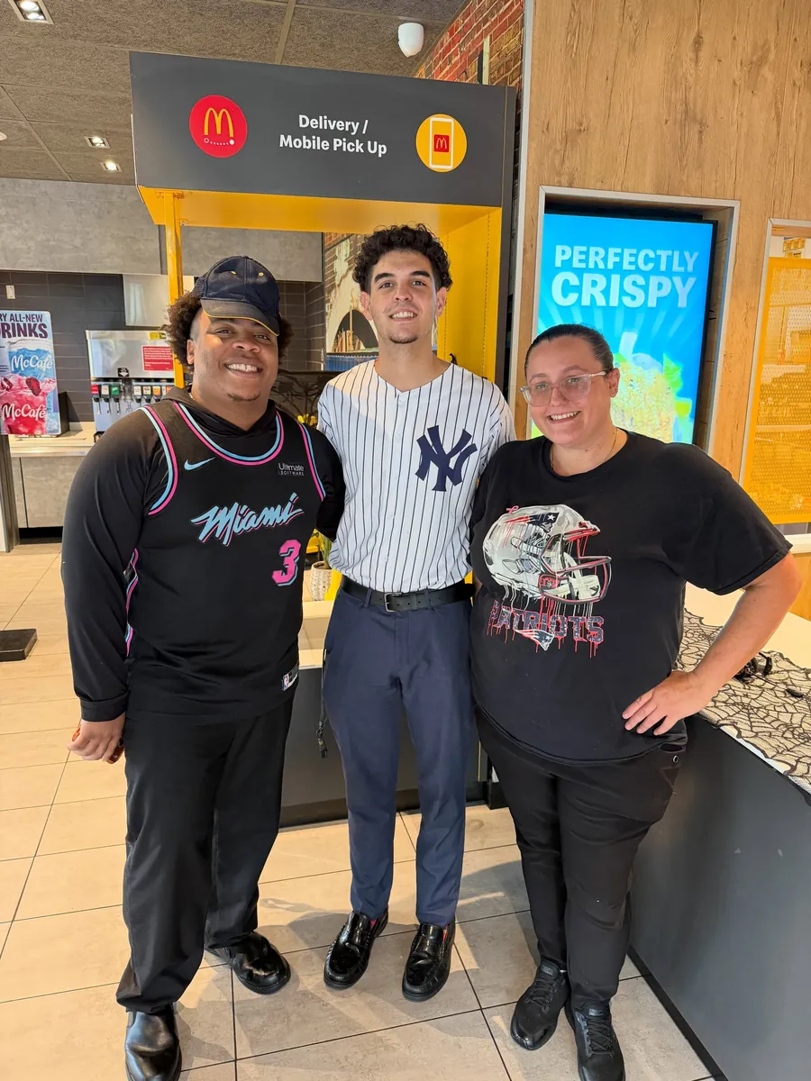 Crew members in sports shirts for Superfan Sunday