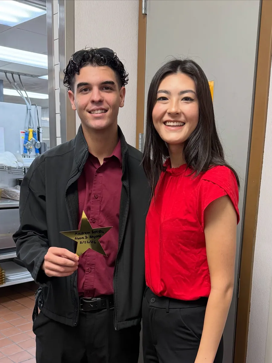 Two team members with a gold star for Golden Stars shout-outs
