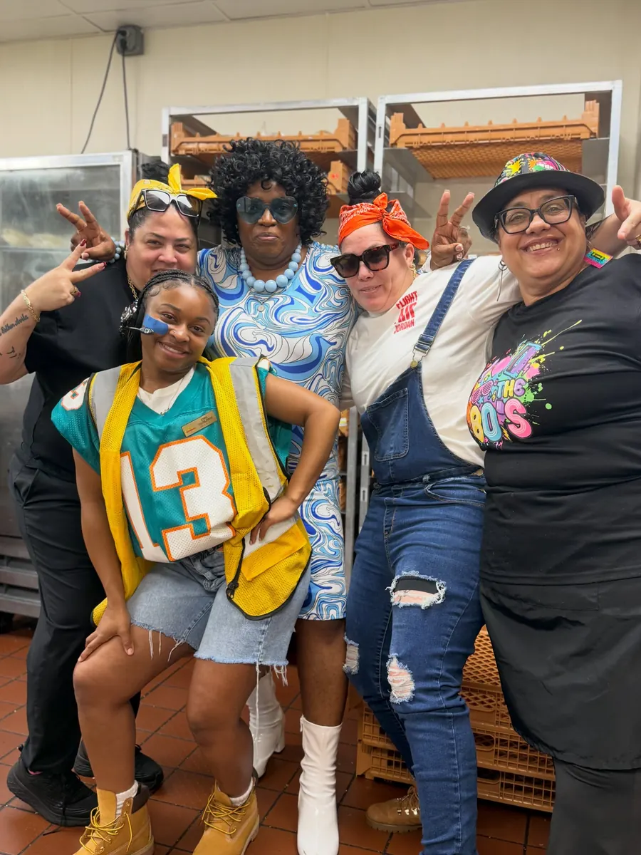 Crew in 80s and 90s outfits for Throwback Thursday