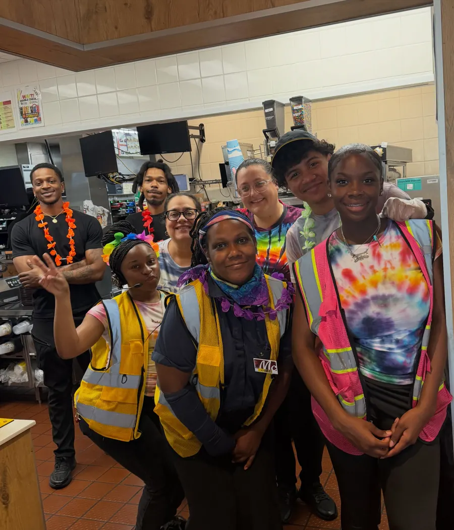 Crew in tie-dye shirts and safety vests for Tie Dye Tuesday