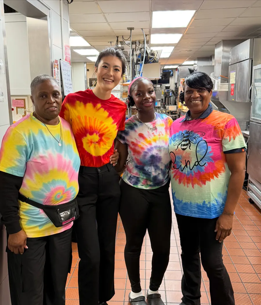 Crew members in bright tie-dye shirts for Tie Dye Tuesday